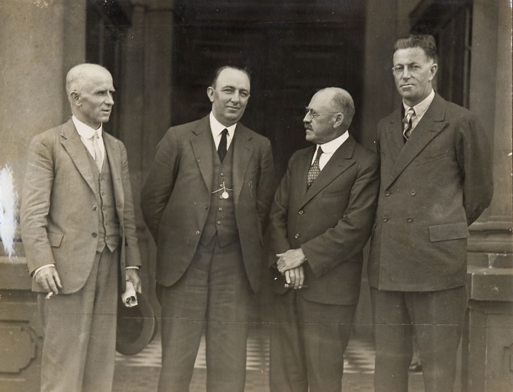 Norman Wizard Smith and Don Harkness and two other men (on steps of Sydney Town Hall], 1926 - 1936