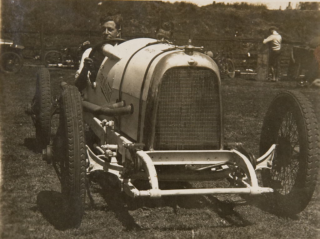 Don Harkness at the wheel of his Overland Sports car Whitey