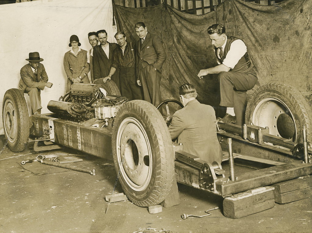 Group inspecting the car F.H. Stewart Enterprise