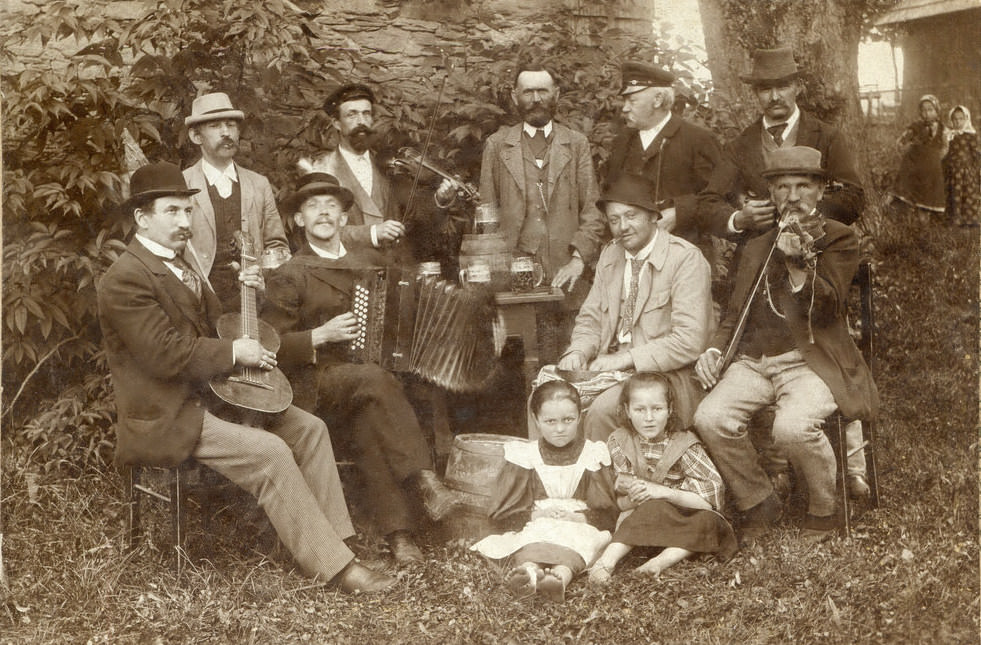 A cheerful group celebrating New Year's Eve, 1890s.