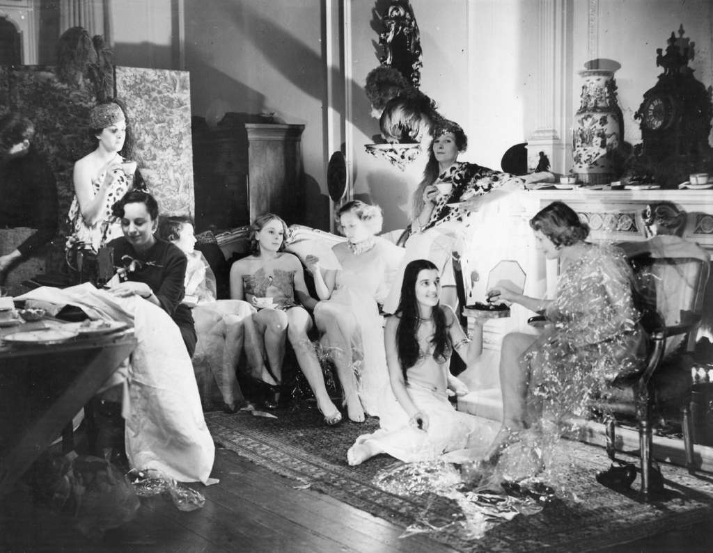 Kensington Studios employees having a tea break, preparing for the Chelsea Arts Ball, 1935.