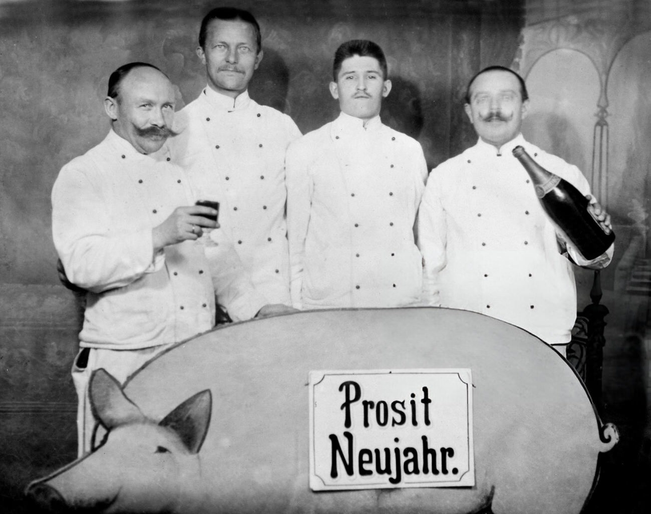 Four men toasting the New Year in Germany, 1925.