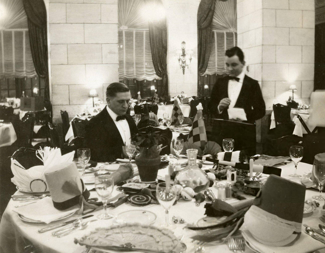 A man dining alone at the Gibson Hotel in Cincinnati, Ohio, on New Year's Eve, 1925.