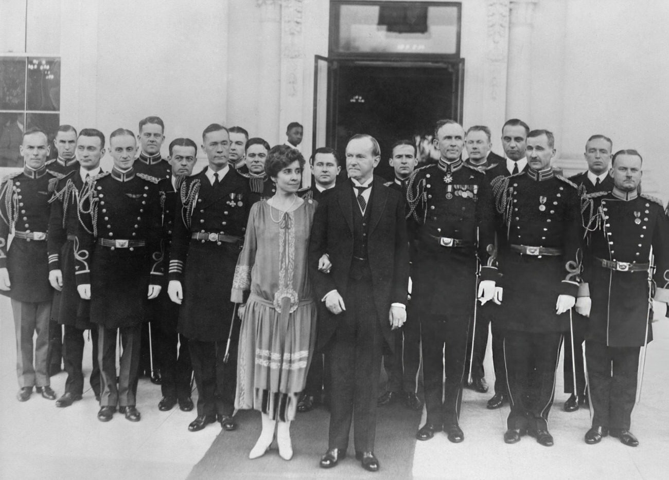 President Calvin Coolidge and his wife wishing a Happy New Year, 1927.