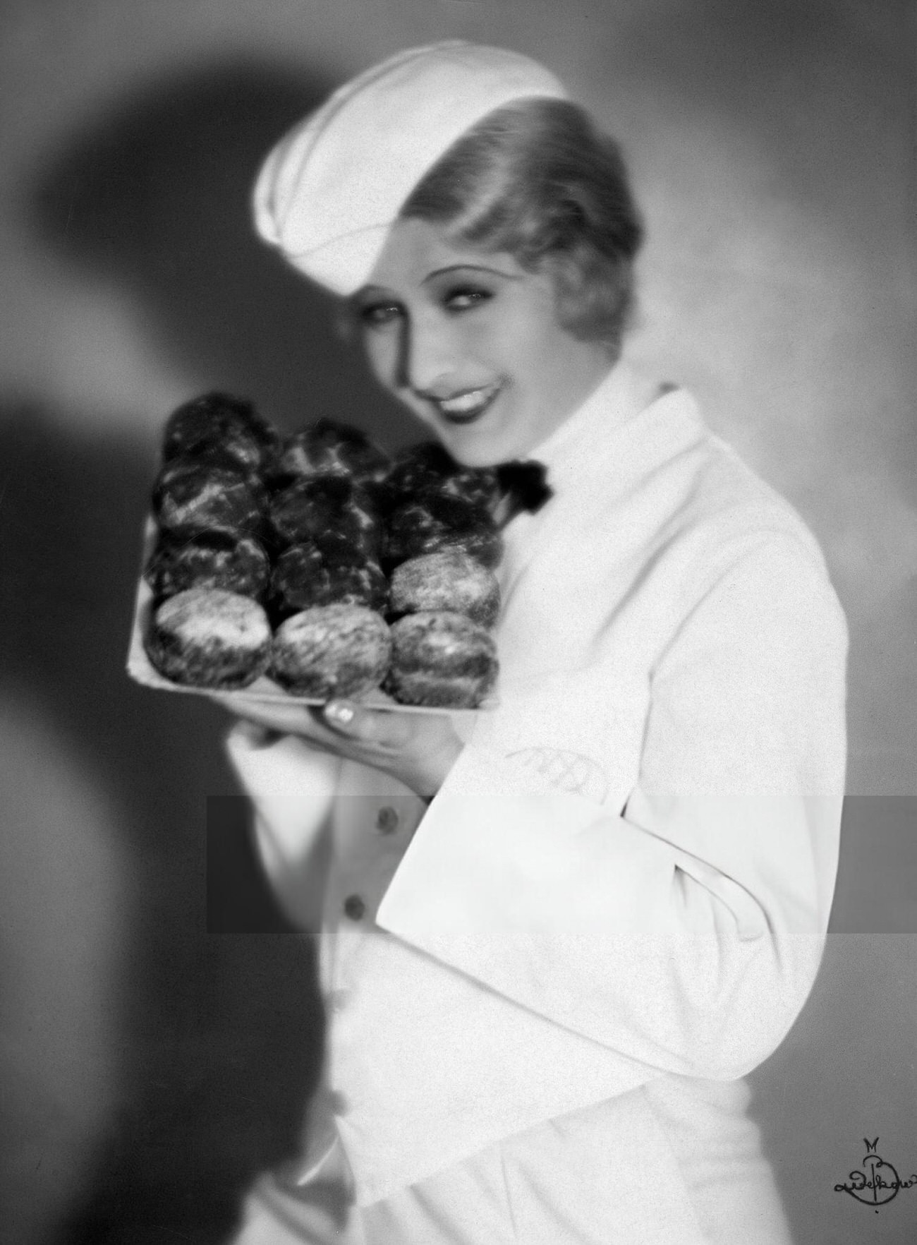 Lee Parry presenting doughnuts for New Year's Eve, 1920s.