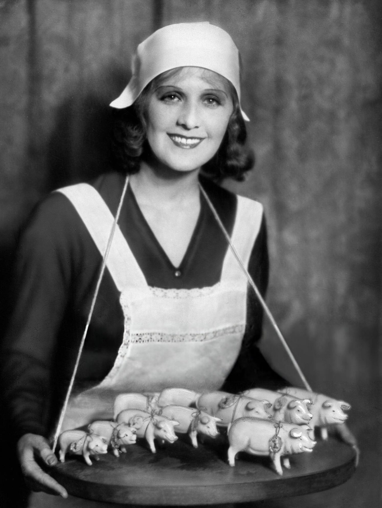 Vera Malinowskaja presenting lucky pigs for New Year's Eve, 1929.