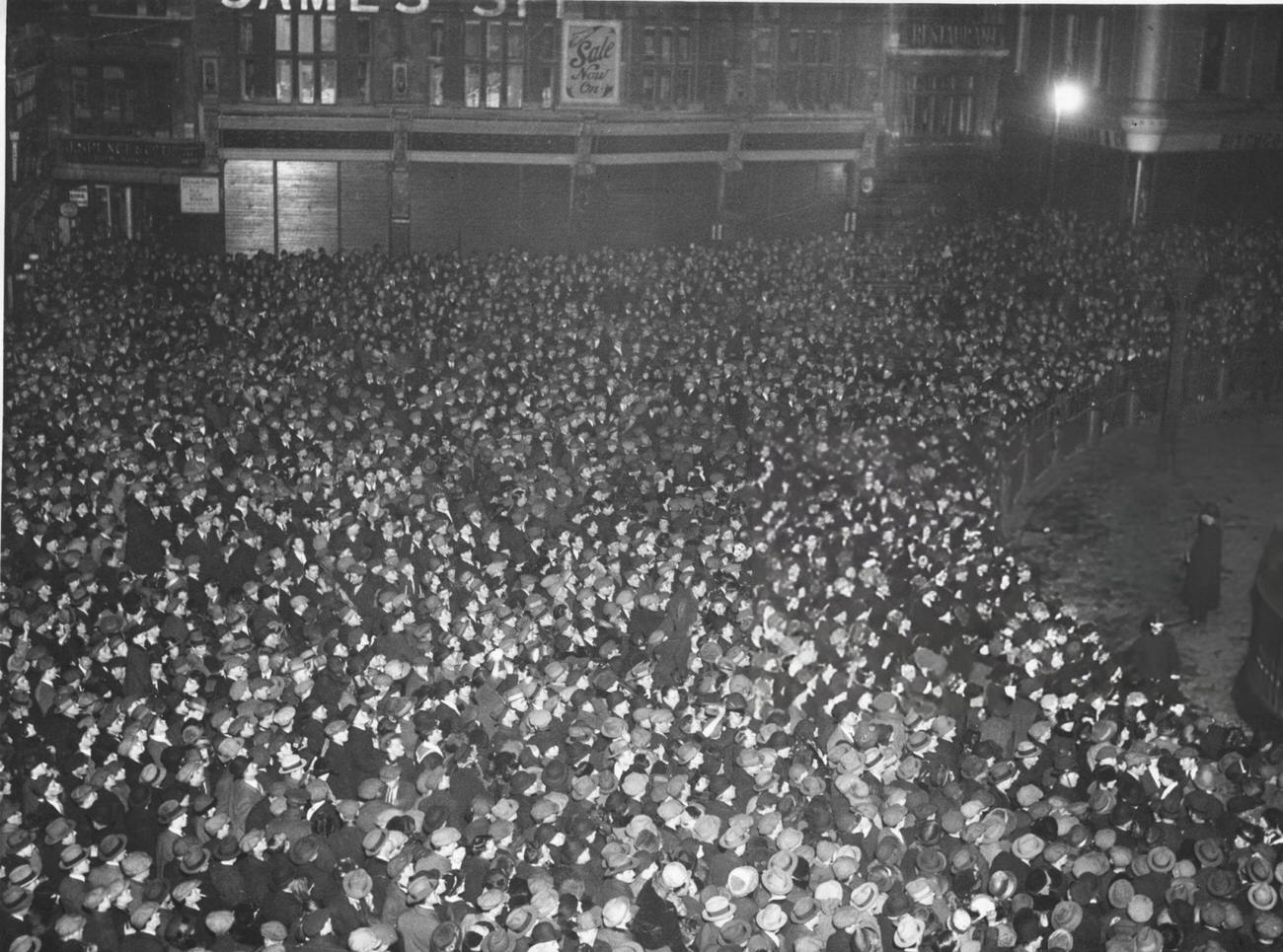 A crowd outside St. Paul's Cathedral, London, celebrating New Year's Eve, 1924.