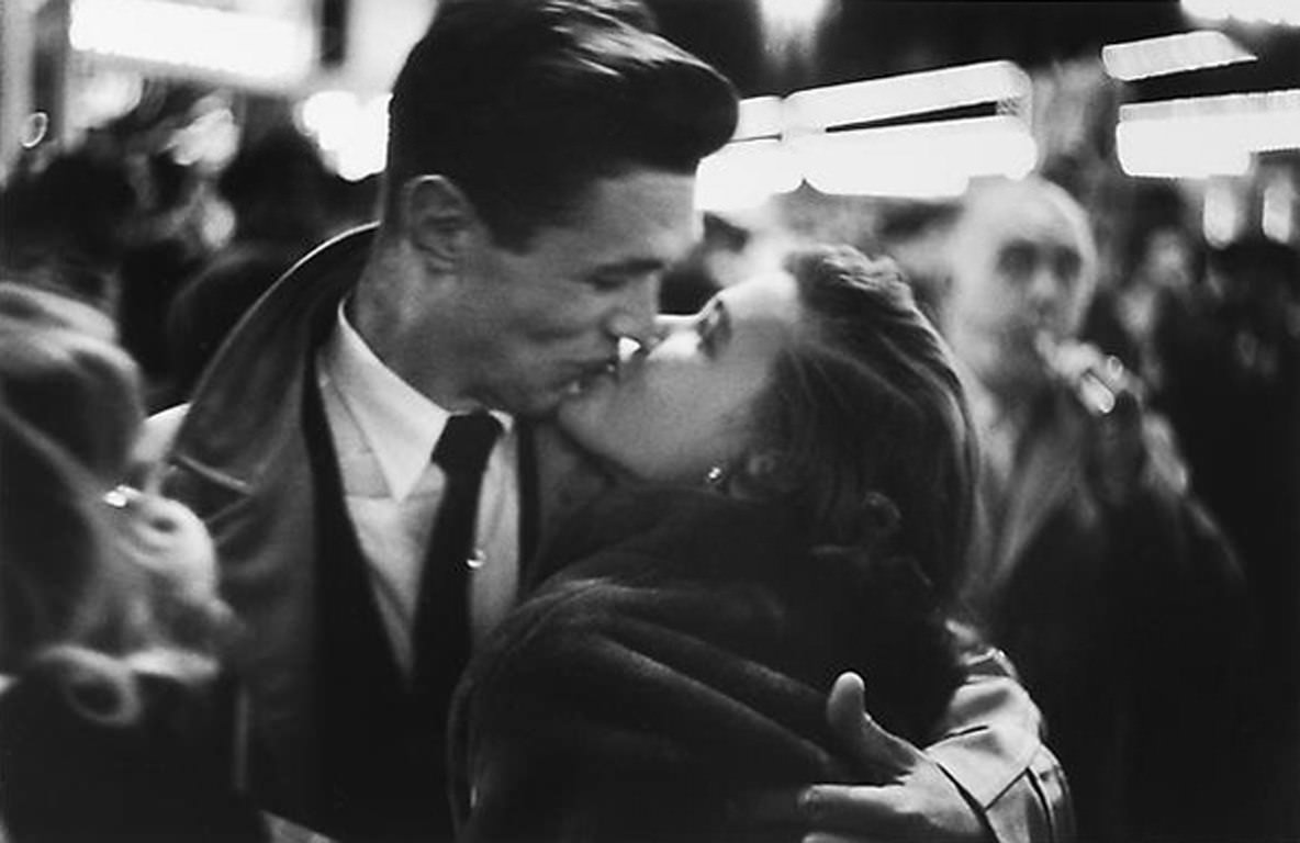 Couple kissing on New Year's Eve, ca. 1950s