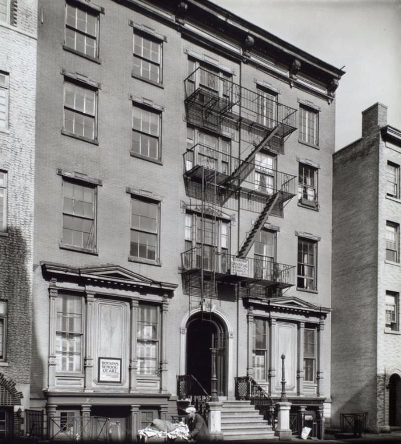 Grove Street, No. 45, Manhattan. Man pushing cart past building with sign for Boykin School of Art.