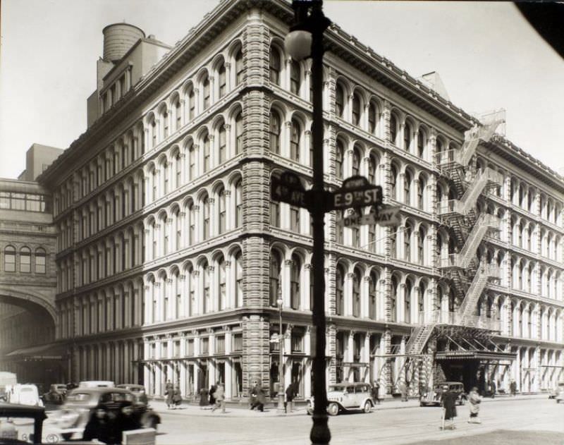 John Wanamakers's, Fourth Avenue and 9th Street, Manhattan. Looking at iron-front store originally built by A.T. Stewart from across 4th Ave.; bridge connecting with annex at left, traffic, pedestrians.