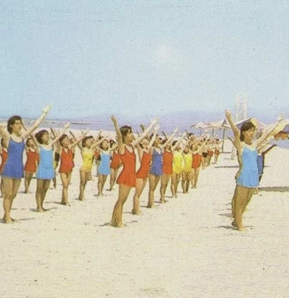 Gymnastics classes were another of the cultural offerings for potential communist visitors. Women are pictured taking part in a class on Songdowon beach here.