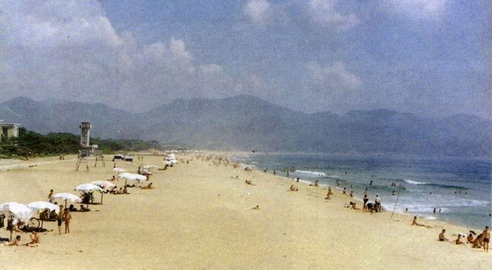 Unlike the beaches of Spain or Greece, which would have been packed with tourists in the 1990s when this snap was taken, the sand in Hamhung is virtually deserted.