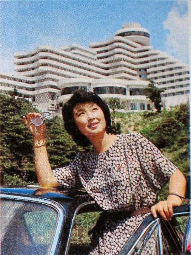 A woman hails a taxi outside Ryanggang Hotel, in Pyongyang, in 1986.