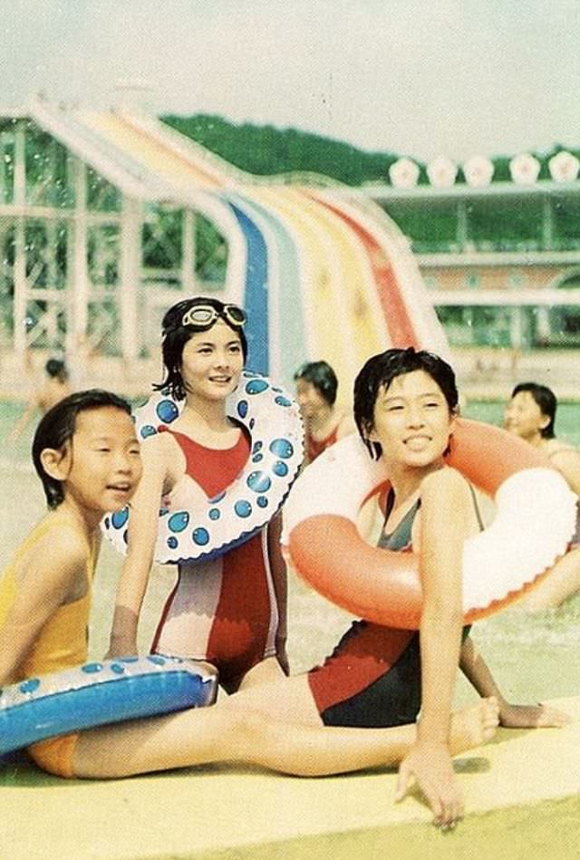 A mother and her children relax at Taesongsan Waterpark, located near the capital.