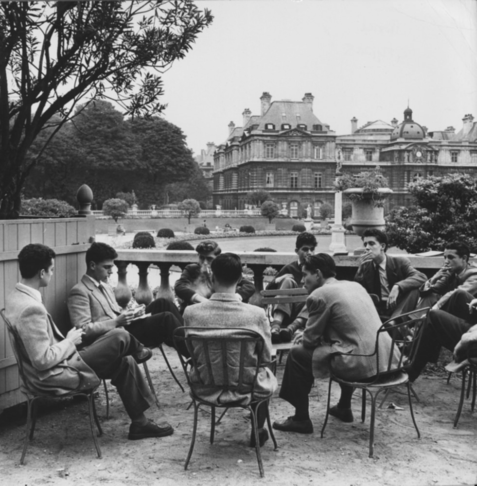 Students from the Sorbonne kick it in the Luxembourg Gardens, 1950.