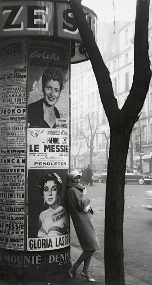 A very fashionable lady waits. But for whom, we ponder. 1960.