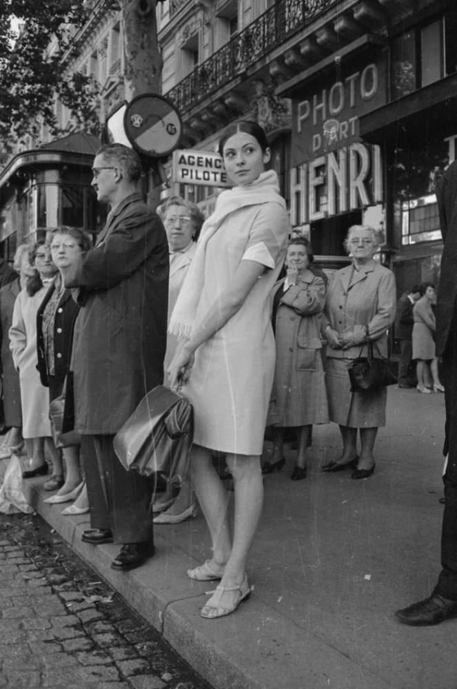 Russian ballerina Sonia Petrovna waits for le bus, showing restraint by not dancing, 1966.