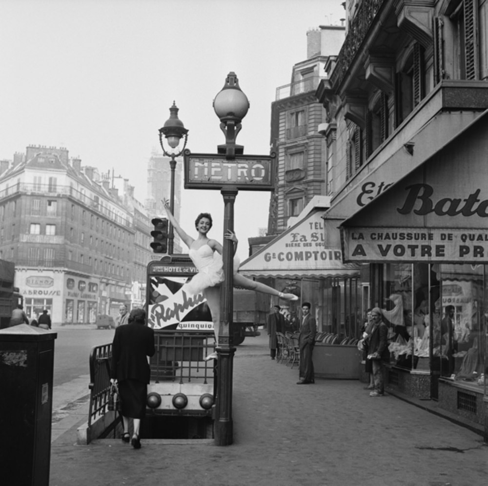 A ballerina demonstrates the correct way to enter the Parisian métro, 1955.