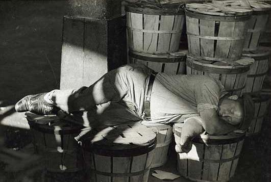 Sleeping with the fishes at the Baltimore fish market, 1938.