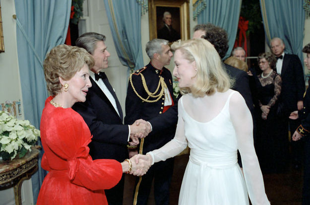 Nancy Reagan shaking hands with Meryl Streep