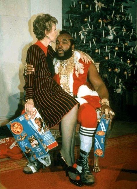 Nancy Reagan sitting on Mr. T's lap.