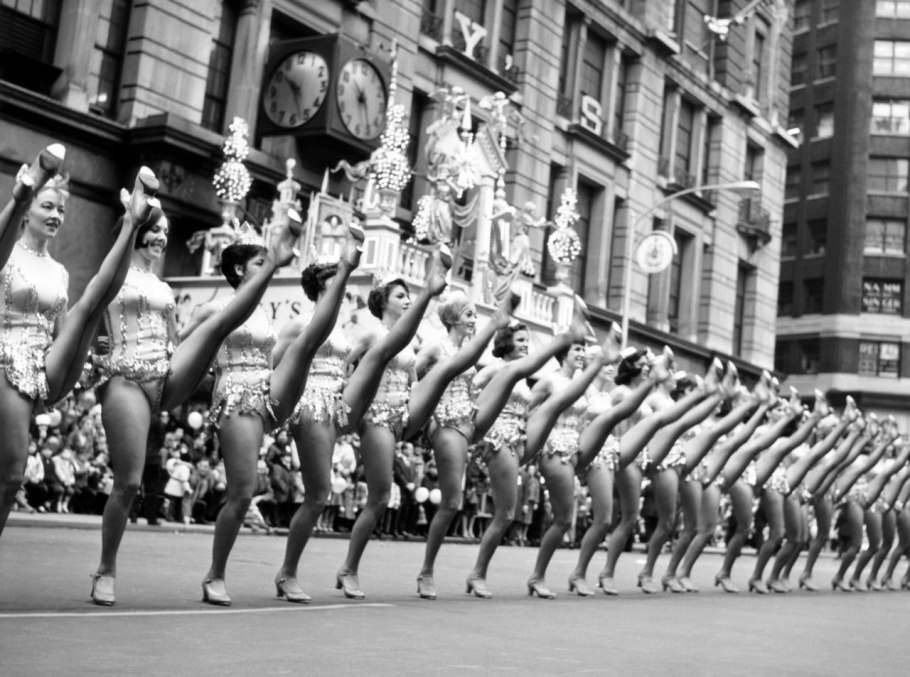 The famous high kick! At the Macy’s Thanksgiving Day parade in 1964, the Rockettes (in teensy onesies) perform in front of thousands of bundled-up onlookers.