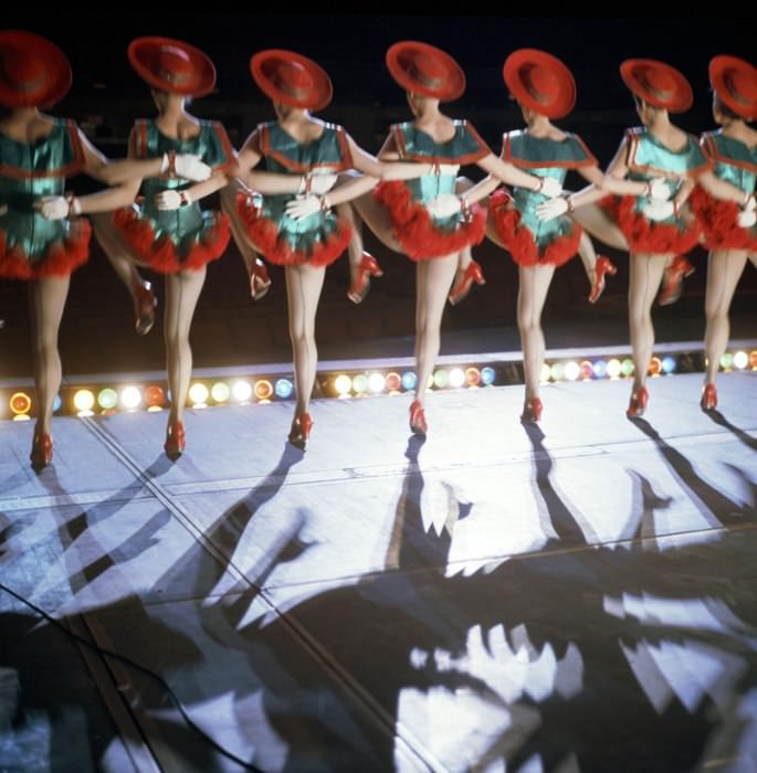 In 1967, the girls took traditional Christmassy red and green and put them on cancan costumes, complete with Spanish-inspired hats and sexy seamed stockings.