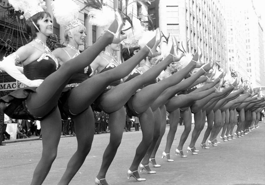 The parade-dancing routine embraced the 1970s with sparkling chokers, feather-sprouting showgirl hats, and thicker tights. The caption that ran with this photo in a 1973 edition of the New York Daily News? “Just to make sure Dad doesn’t get bored . . . ”