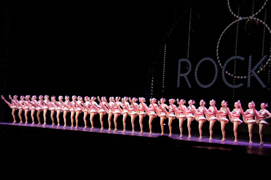 At 85, the troupe still reprises bits of earlier shows (a candy-cane motif on these costumes) and its trademark choreography.