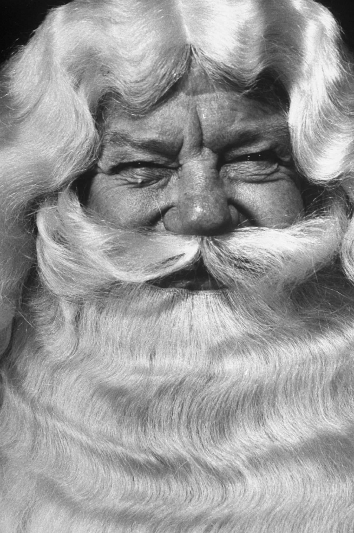 On third day of school, Marine John Ray learns how to squint his eyes into a Santa twinkle. His wig and beard are of yak hair. Ray will work at the W. G. Swartz store in Norfolk, Va.