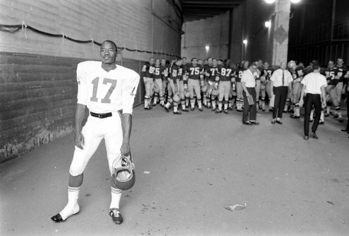 Kansas City's Fletcher Smith, with the Green Bay Packers massed behind him, prior to the start of Super Bowl I, Los Angeles, 1967