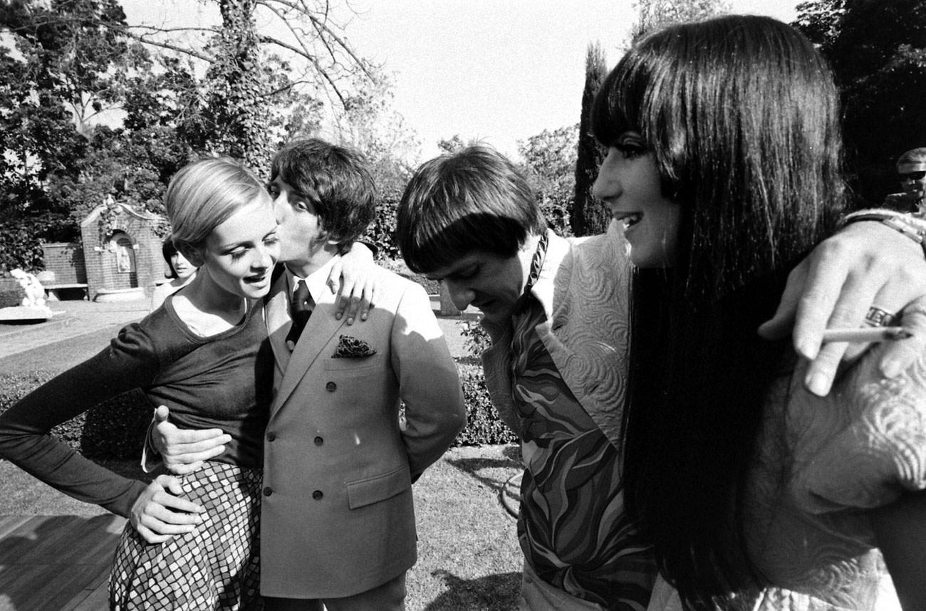 Twiggy with boyfriend and manager Justin De Villeneuve (kissing her) and Sonny and Cher (right) at a party thrown for the English supermodel in Beverly Hills, 1967.