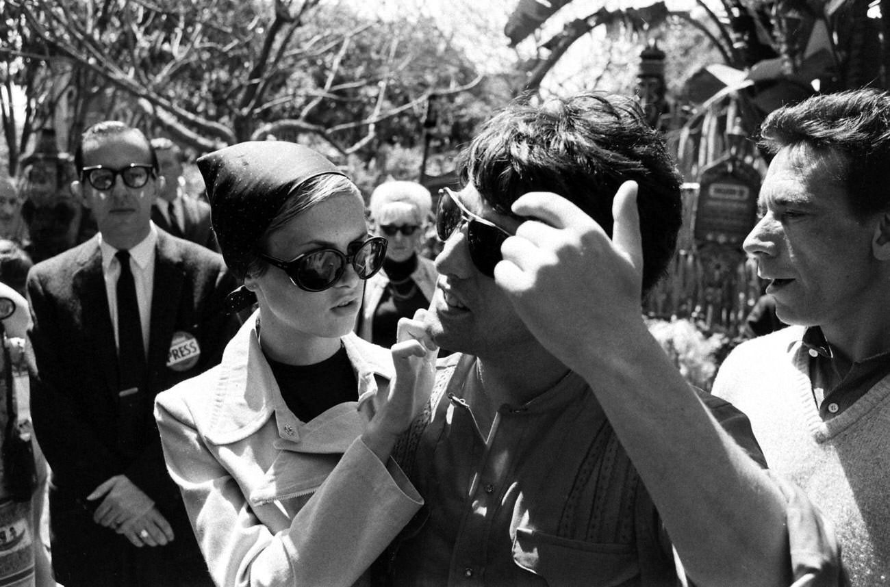 Twiggy with boyfriend and manager Justin De Villeneuve at Disneyland during her first visit to the U.S., 1967.