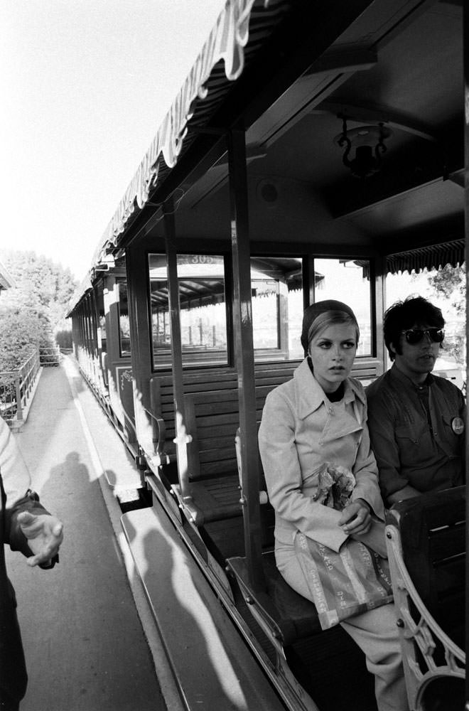 Twiggy with her boyfriend and manager Justin De Villeneuve at Disneyland during her first visit to the U.S., 1967.