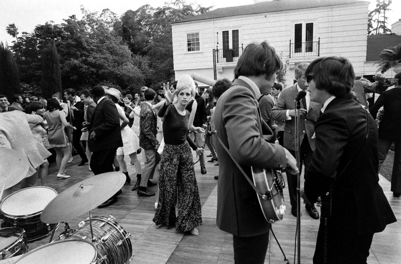 Twiggy (center, long dress) at a party thrown for her in Beverly Hills, 1967.