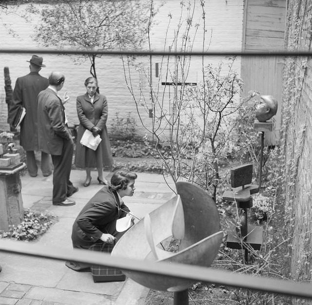 A domestic garden functioning as an art gallery in Greenwich Village, 1955.