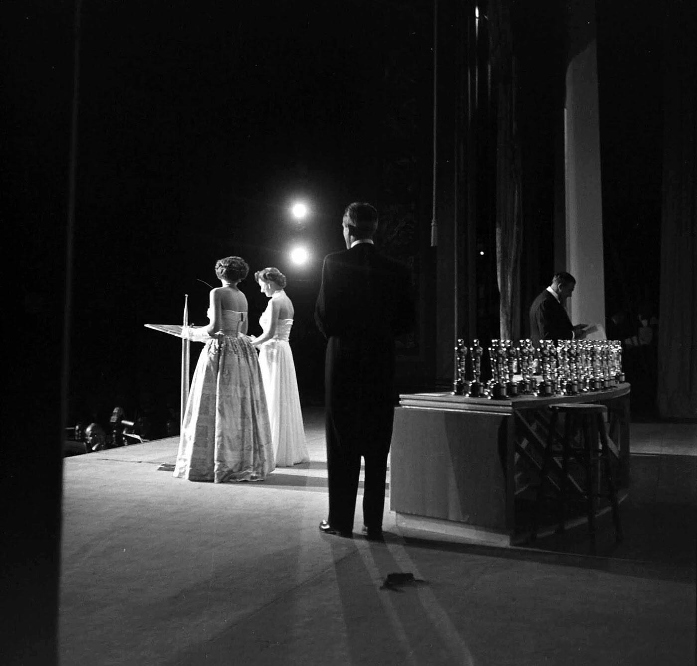 Onstage presenters seen from the wings during the 1950 Academy Awards.