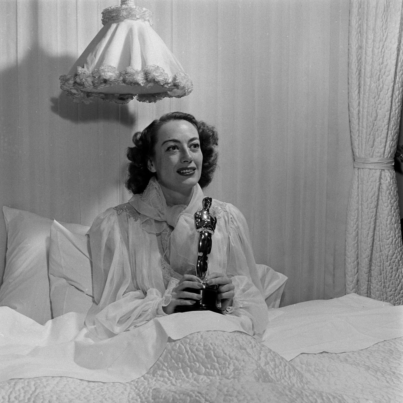 Joan Crawford with her Best Actress Oscar for Mildred Pierce, 1946.