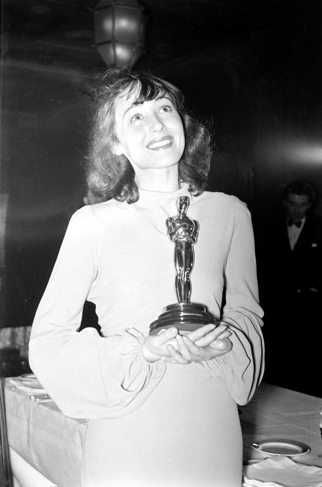 Luise Rainer, the first woman to win two Oscars, holds her Best Actress award for her performance in The Great Ziegfeld during the 1937 Academy Awards ceremony.