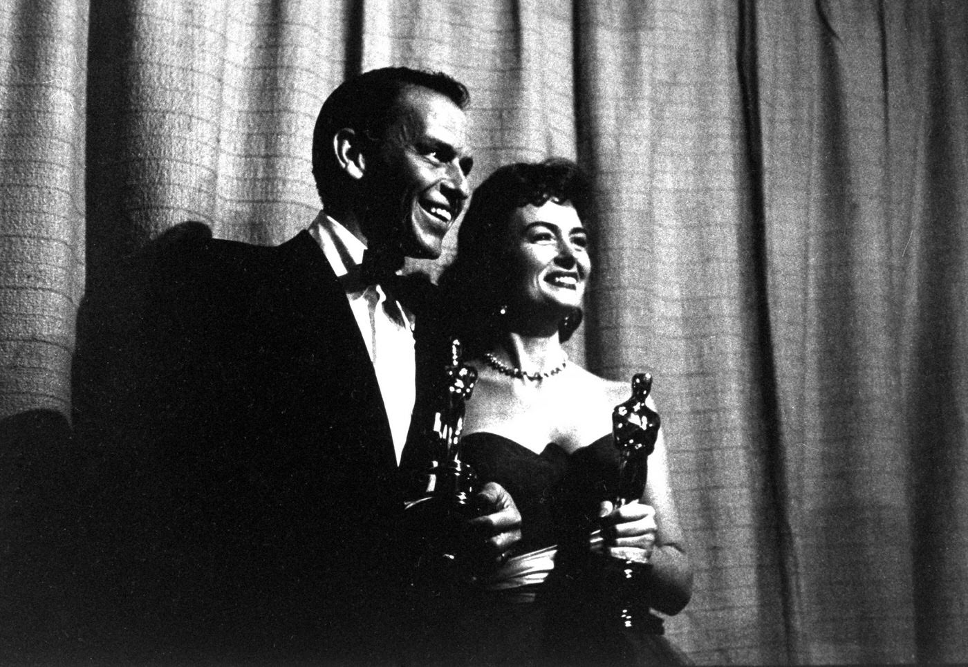 Best Supporting Actor and Supporting Actress winners Frank Sinatra and Donna Reed (both for From Here to Eternity) and their Oscars, 1954.