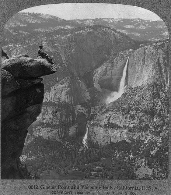 Man sitting on Glacier Point, January 2, 1909.