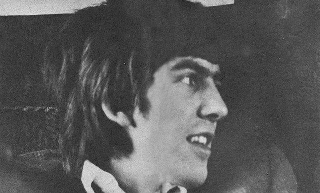 George Harrison almost smiling.